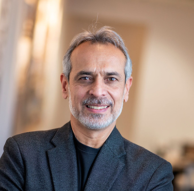Alexander Dzurec Sanjay Engineer, middle eastern man with grey hair and beard