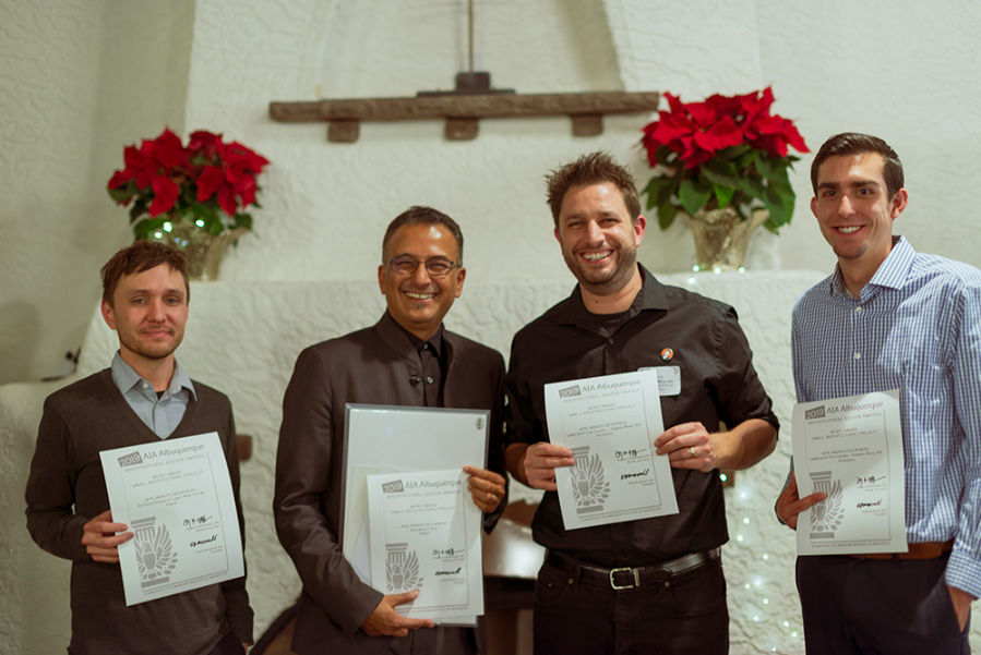 4 adult men standing holding certificates