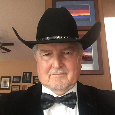 George Carver, old man wearing a black cowboy hat and a bowtie